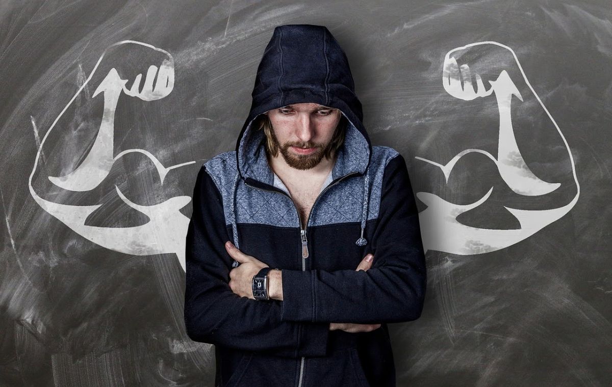 A man in a jacket near some strength images